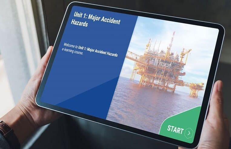 A person is holding a tablet displaying an e-learning course on "Major Accident Hazards." The screen shows a unit titled "Unit 1: Major Accident Hazards" with an offshore oil rig in the background and a green button labeled "Start" for this OPITO-approved refresher course.